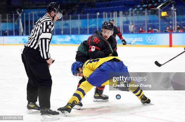Jordan Weal of Team Canada and Marcus Kruger of Team Sweden face off in the third period during the Men’s Ice Hockey Quarterfinal match between Team...