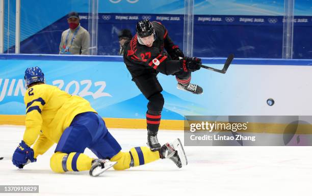 Adam Cracknell of Team Canada takes a shot in the third period during the Men’s Ice Hockey Quarterfinal match between Team Sweden and Team Canada on...
