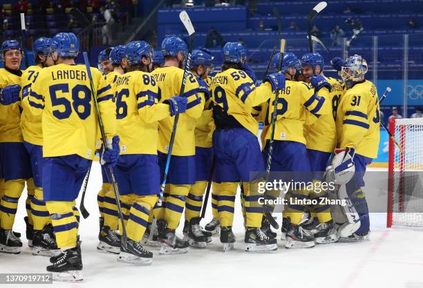 Team Sweden celebrates after the Men’s Ice Hockey Quarterfinal match between Team Sweden and Team Canada on Day 12 of the Beijing 2022 Winter Olympic...