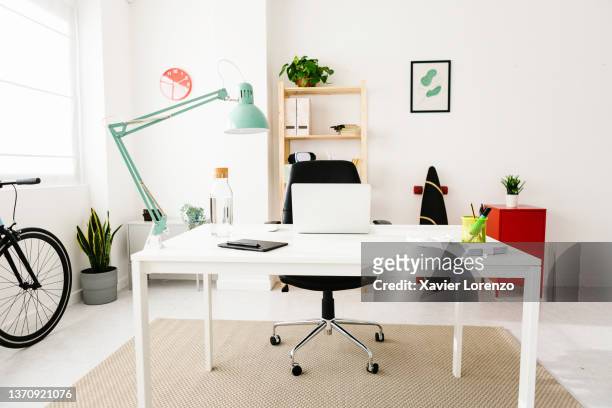 interior view of a bright and modern creative workspace. - desk lamp fotografías e imágenes de stock