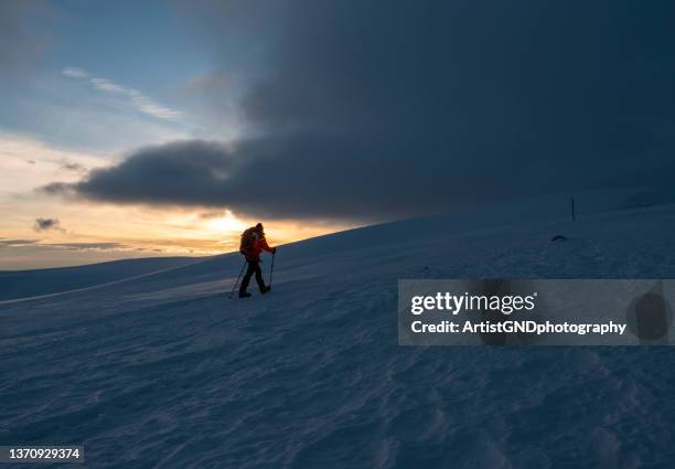 mountaineering in the winter on sunset. - snowfield stock pictures, royalty-free photos & images