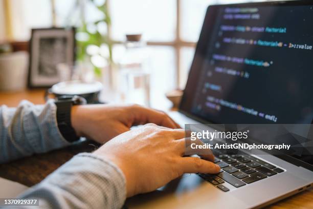 close up of computer programmer coding. - coding laptop stock pictures, royalty-free photos & images
