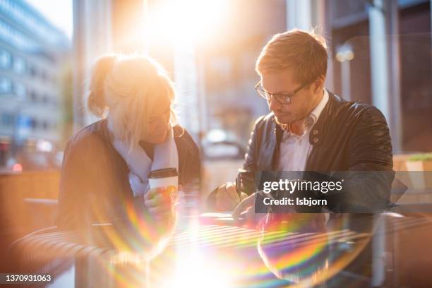 men and woman on business meeteng - rainbow lens flare stock pictures, royalty-free photos & images