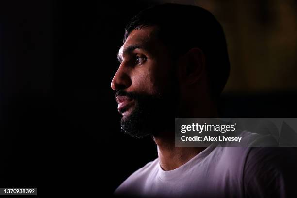 Amir Khan looks on during a tv interview after a BOXXER Media work out ahead of his fight against Kell Brook at The Trafford Centre on February 16,...