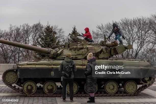 Children play on a tanks displayed at the Motherland Monument on the newly created "Unity Day" on February 16 in Kyiv, Ukraine. "Unity Day" was...