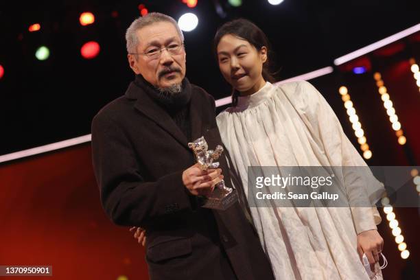 Hong Sangsoo winner of the Silver Bear Grand Prize for the film "So-seol-ga-ui Yeong-hwa " and actress Kim Minhee are seen n stage at the closing...
