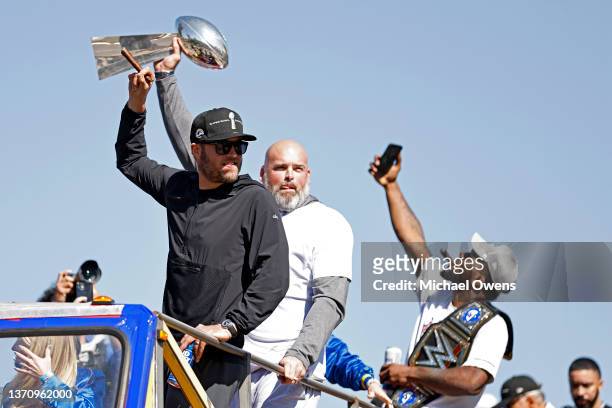 Matthew Stafford of the Los Angeles Rams and Andrew Whitworth celebrate during the Super Bowl LVI Victory Parade on February 16, 2022 in Los Angeles,...