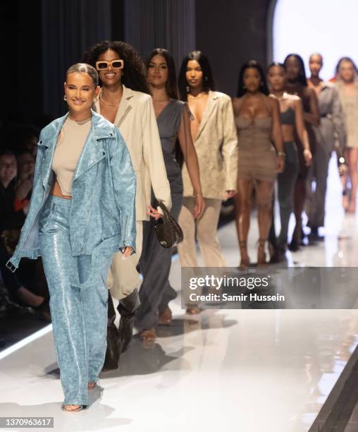 Molly Mae walks the catwalk during the PrettyLittleThing X Molly-Mae show at The Londoner Hotel on February 16, 2022 in London, England.