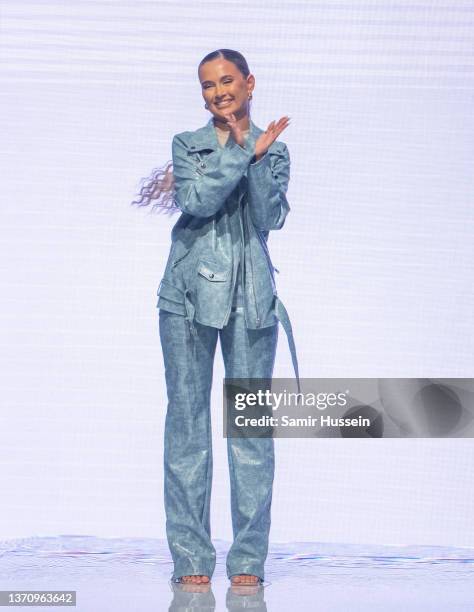 Molly Mae walks the catwalk during the PrettyLittleThing X Molly-Mae show at The Londoner Hotel on February 16, 2022 in London, England.