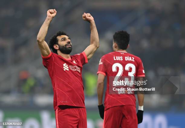 Mohamed Salah of Liverpool celebrates after scoring their side's second goal during the UEFA Champions League Round Of Sixteen Leg One match between...