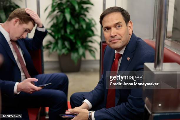 Sen. Marco Rubio speaks to a reporter as he rides a train car in the during a series of votes on Capitol Hill on February 16, 2022 in Washington, DC....