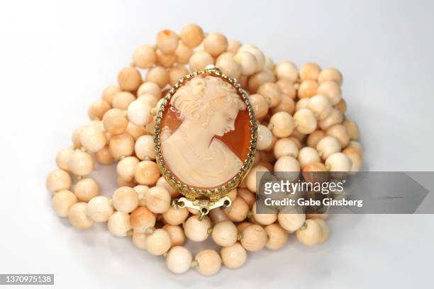 vintage jewelry on white background - vintage brooch stock pictures, royalty-free photos & images