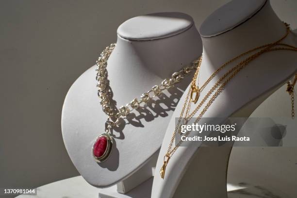 shopping in a luxury jewelry store. - jewelry shop stock pictures, royalty-free photos & images