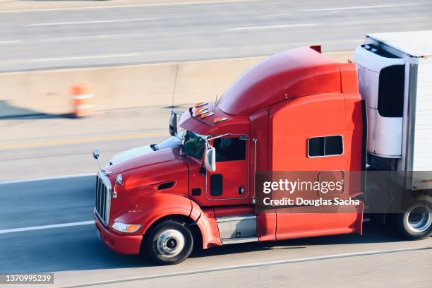 heavy duty semi truck on the highway - semi truck imagens e fotografias de stock