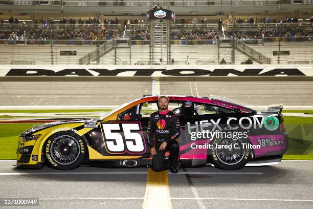 Yeley, driver of the Hex.com Ford, poses for a photo on the grid during qualifying for the NASCAR Cup Series 64th Annual Daytona 500 at Daytona...