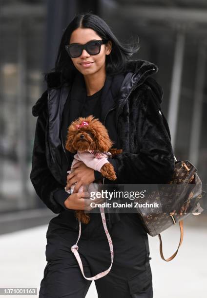 Model is seen with a puppy outside the Prabal Gurung show during New York Fashion Week A/W 2022 on February 16, 2022 in New York City.