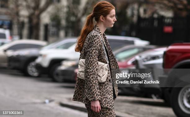 Model is seen wearing an animal print suit and white bag outside the Prabal Gurung show during New York Fashion Week A/W 2022 on February 16, 2022 in...