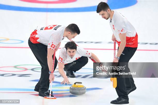 Valentin Tanner, Peter de Cruz and Sven Michel of Team Switzerland compete against Team Sweden during the Men’s Curling Round Robin Session on Day 13...