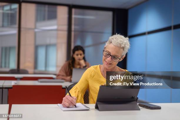 mature adult student attending university class - australian womens training session stock pictures, royalty-free photos & images