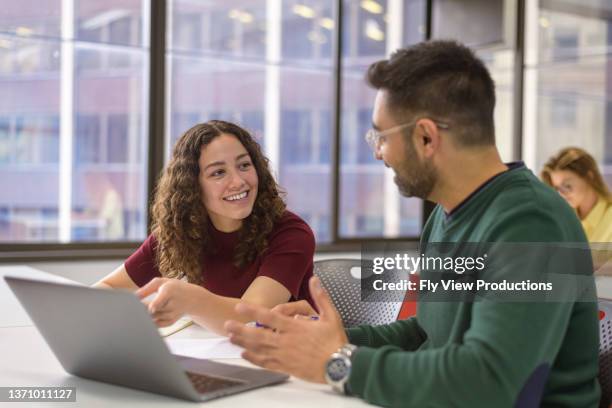 university students working on group assignment - university student australia stock pictures, royalty-free photos & images