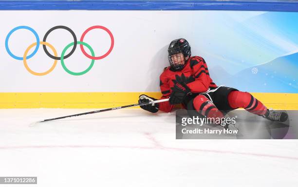 Sarah Fillier of Team Canada reacts to a hit in the first period during the Women's Ice Hockey Gold Medal match between Team Canada and Team United...