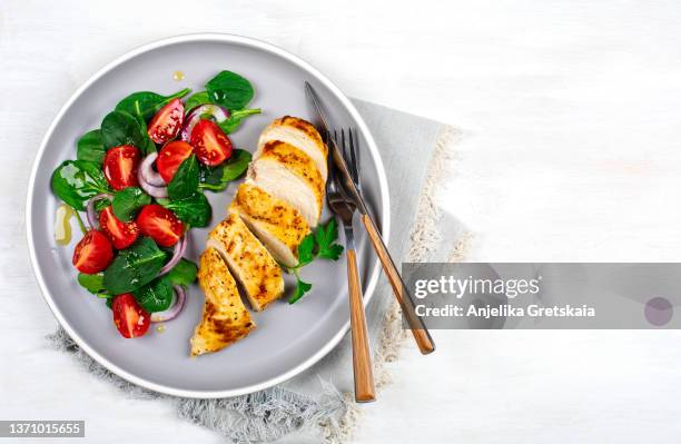 baked chicken fillet with vegetable salad. healthy food. - grilled chicken imagens e fotografias de stock