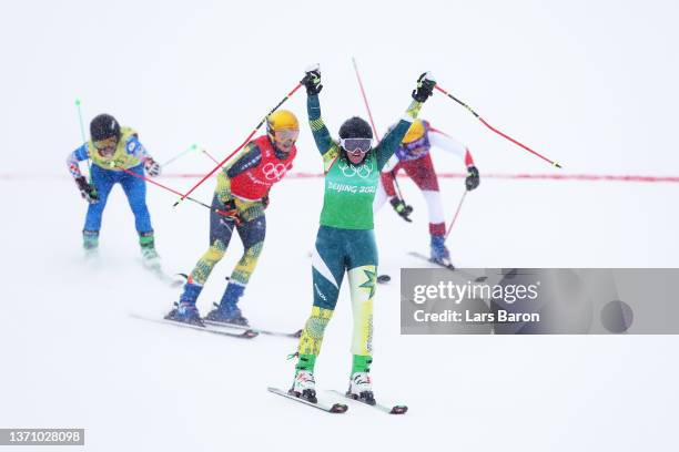 Sami Kennedy-Sim of Team Australia celebrates after winning the Women's Freestyle Skiing Ski Cross Quarter Final on Day 13 of the Beijing 2022 Winter...