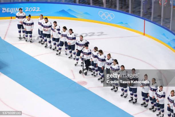 Team United States line up together during the medal ceremony after their 3-2 loss against Team Canada in the Women's Ice Hockey Gold Medal match...