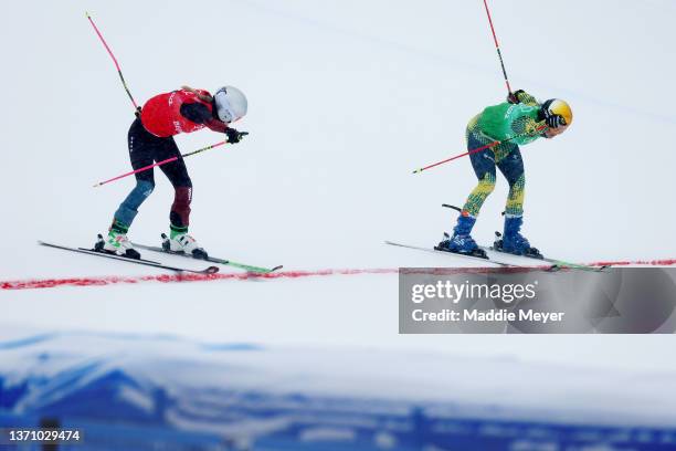 Fanny Smith of Team Switzerland and Daniela Maier of Team Germany cross the finish line during the Women's Freestyle Skiing Ski Cross Semifinal on...