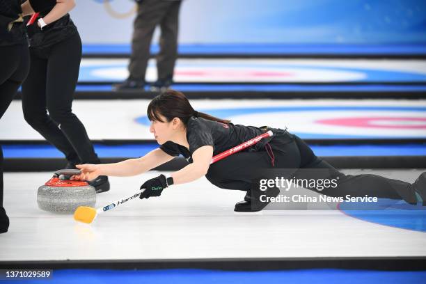 Yumi Suzuki of Team Japan competes against Team United States during the Women's Round Robin Session on Day 12 of the Beijing 2022 Winter Olympic...