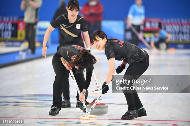 Yurika Yoshida, Chinami Yoshida and Yumi Suzuki of Team Japan compete against Team United States during the Women's Round Robin Session on Day 12 of...