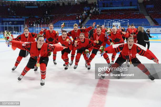 Team Canada celebrates their gold medals after winning the Women's Ice Hockey Gold Medal match between Team Canada and Team United States on Day 13...