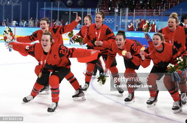 Team Canada celebrates with their gold medals after winning the Women's Ice Hockey Gold Medal match between Team Canada and Team United States on Day...