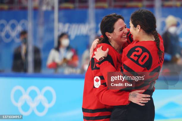 Melodie Daoust and Sarah Nurse of Team Canada celebrate after Team Canada defeated Team United States 3-2 in the Women's Ice Hockey Gold Medal match...