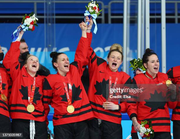 Gold medal winners Sarah Fillier, Jill Saulnier, Renata Fast and Melodie Daoust of Team Canada celebrate during the medal ceremony after the Women's...