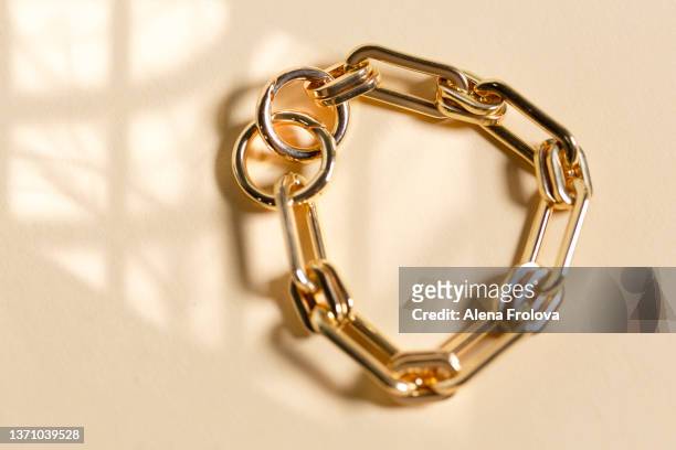 jewelry on  beige background - chain stock pictures, royalty-free photos & images