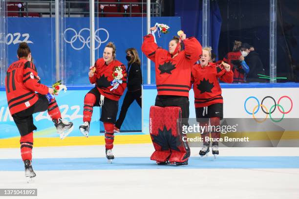 Gold medal winners Jill Saulnier, Marie-Philip Poulin, Kristen Campbell and Emma Maltais of Team Canada celebrate during the medal ceremony after the...