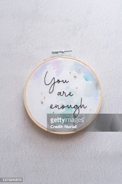 overhead view of an embroidery hoop with the words you are enough - embroidery frame stock pictures, royalty-free photos & images