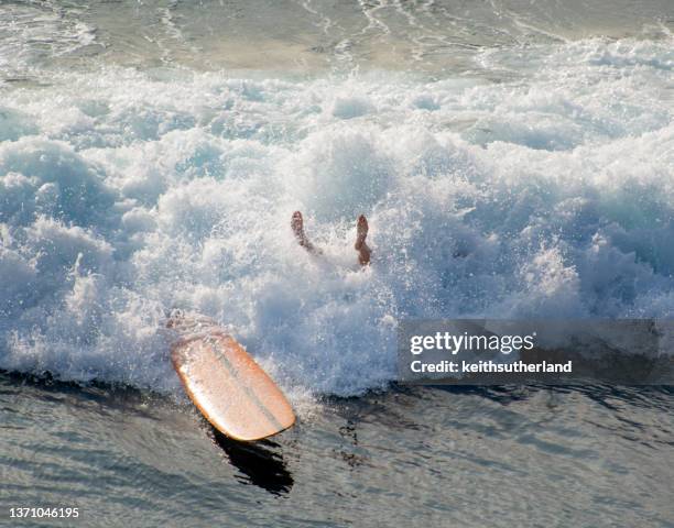 overhead view of a surfer falling into the ocean, maui, hawaii, usa - wipeout stock pictures, royalty-free photos & images