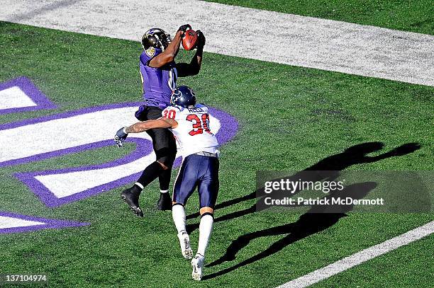 Anquan Boldin of the Baltimore Ravens catches a pass against Jason Allen of the Houston Texans to score a touchdown during the first quarter of the...