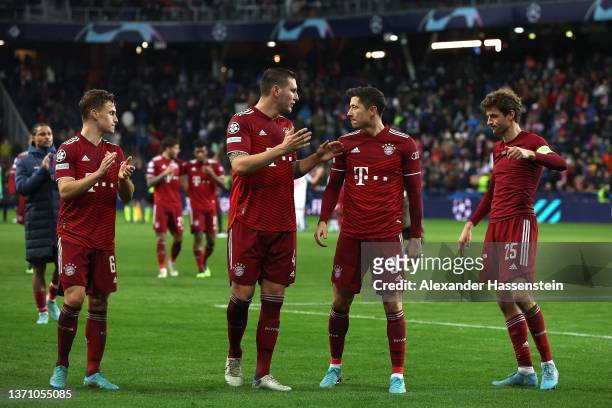 Joshua Kimmich, Niklas Süle, Robert Lewandowski and Thomas Müller of FC Bayern München react after the UEFA Champions League Round Of Sixteen Leg One...