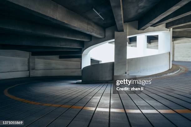 rotary lane in multi-storey parking lot - car park barrier stock pictures, royalty-free photos & images