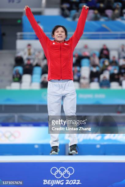Gold medallist Miho Takagi of Team Japan celebrates during the Women's 1000m flower ceremony on day thirteen of the Beijing 2022 Winter Olympic Games...