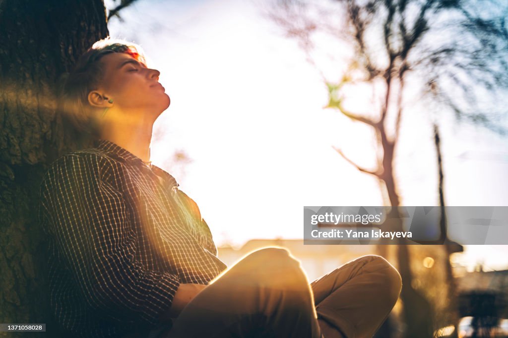 Rest Under Tree Young Handsome Hipster Is Taking A Rest Under The Tree Enjoying Warm ...