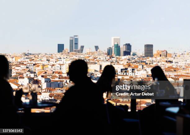 stunning view of madrid city skyline from cool sky bar terrace. - madrid stockfoto's en -beelden