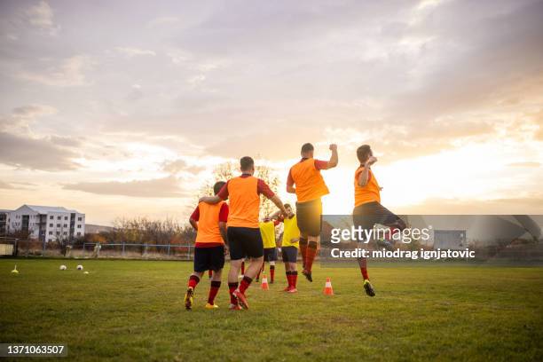unrecognizable happy soccer team, celebrate their win at soccer match - club football stock pictures, royalty-free photos & images