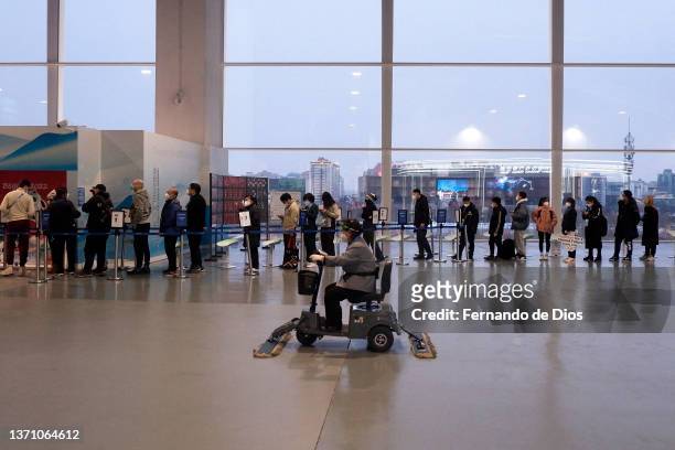 Customers queue at the official merchandise store of the Main Media Centre on day 13 of 2022 Beijing Winter Olympics on February 17, 2022 in Beijing,...