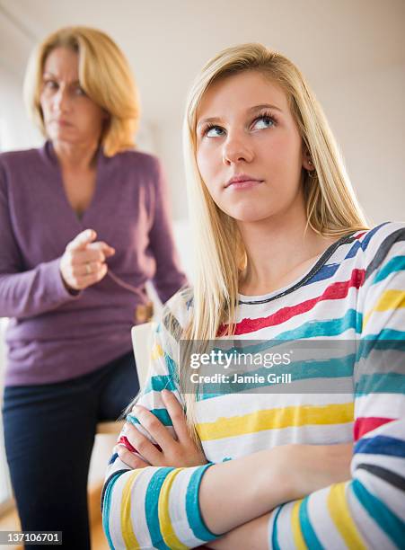 mother yelling at teenage daughter - mom arms crossed stock pictures, royalty-free photos & images