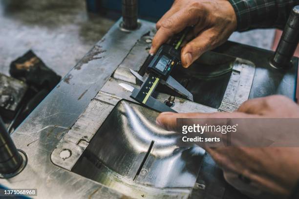 lathe worker man working with a vernier and milling machine in a factory - cnc maschine stock pictures, royalty-free photos & images