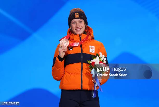 Bronze Medallist Suzanne Schulting of Team Netherlands poses with their medal during the Women's 1500m medal ceremony on Day 13 of the Beijing 2022...